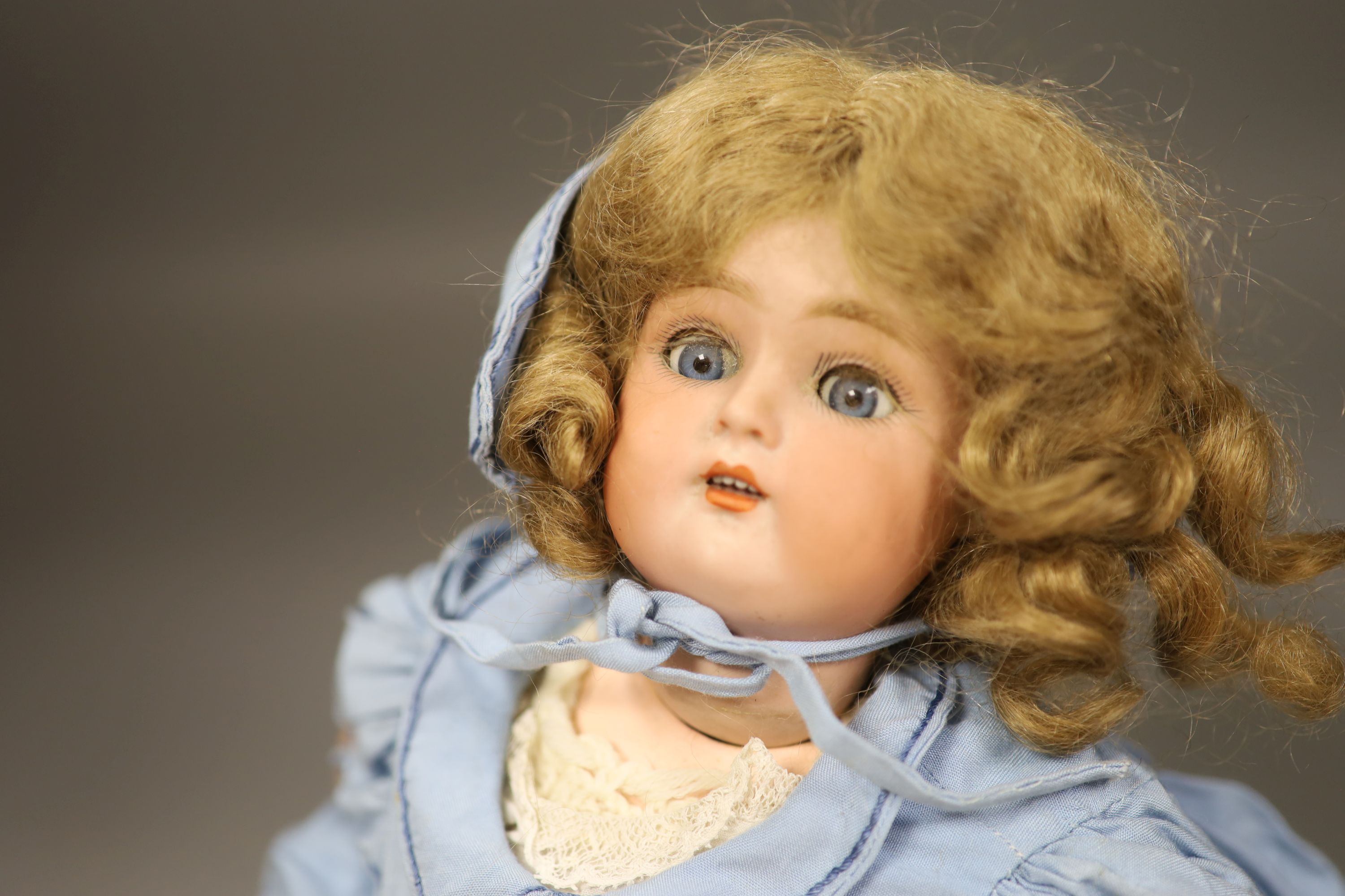 A Kammer and Reinhardt sleeping eyes bisque head doll